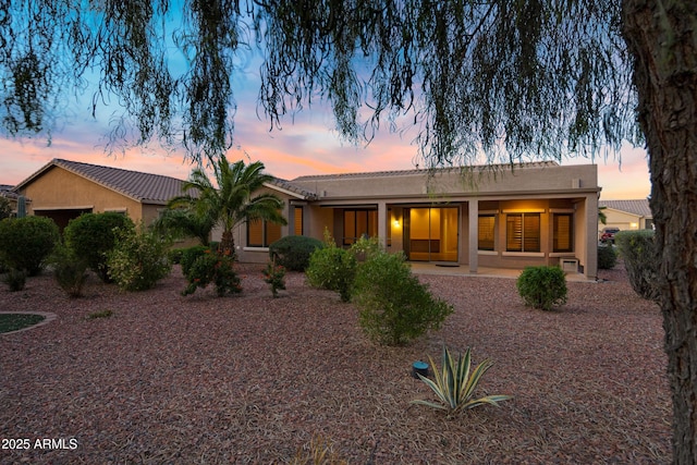 view of front of home featuring stucco siding