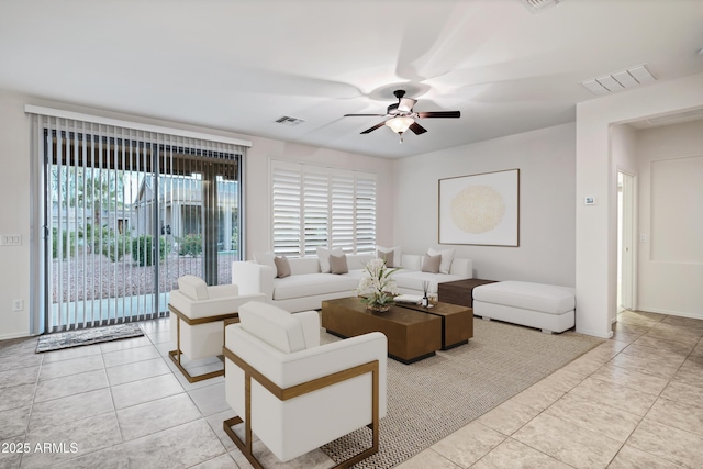 living room with ceiling fan, light tile patterned flooring, and visible vents