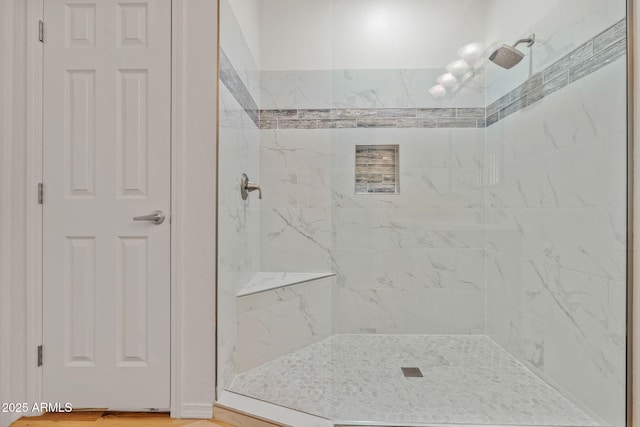 bathroom featuring tiled shower