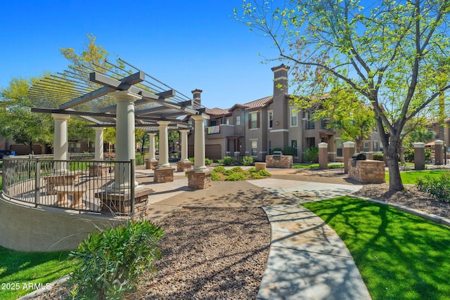 surrounding community with a patio area and a pergola