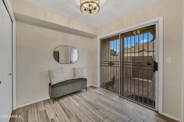 5808 E Brown Rd Unit 49, Mesa, AZ 85205 - unfurnished room with wood finished floors, baseboards, and a chandelier