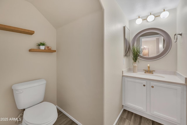 5808 E Brown Rd Unit 49, Mesa, AZ 85205 - half bath with toilet, vanity, wood finished floors, and vaulted ceiling