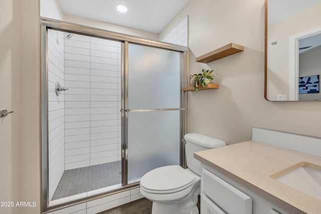 5808 E Brown Rd Unit 49, Mesa, AZ 85205 - full bathroom featuring vanity, toilet, a stall shower, and wood finished floors