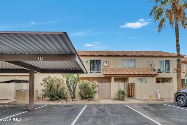 5808 E Brown Rd Unit 49, Mesa, AZ 85205 - view of property featuring a fenced front yard and covered and uncovered parking