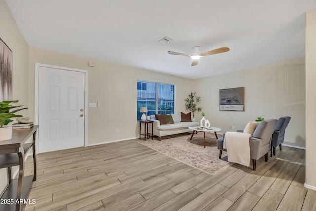 5808 E Brown Rd Unit 49, Mesa, AZ 85205 - living area with light wood-style flooring, ceiling fan, and baseboards