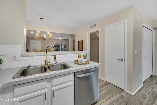 5808 E Brown Rd Unit 49, Mesa, AZ 85205 - kitchen featuring stainless steel dishwasher, a sink, a chandelier, and light countertops
