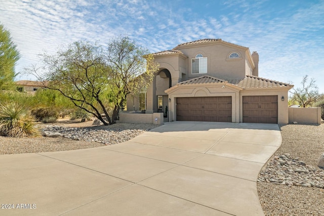 8757 E Lariat Ln, Scottsdale, AZ 85255 - mediterranean / spanish house with driveway, stucco siding, a tiled roof, an attached garage, and a chimney