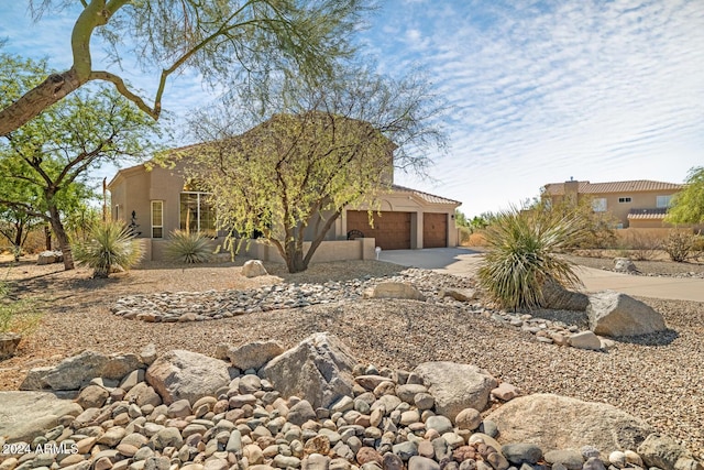 8757 E Lariat Ln, Scottsdale, AZ 85255 - adobe home featuring concrete driveway, a garage, and stucco siding