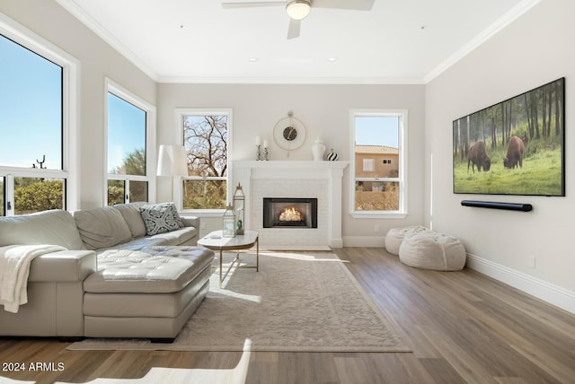 8757 E Lariat Ln, Scottsdale, AZ 85255 - living room featuring ornamental molding, a ceiling fan, a fireplace, wood finished floors, and baseboards
