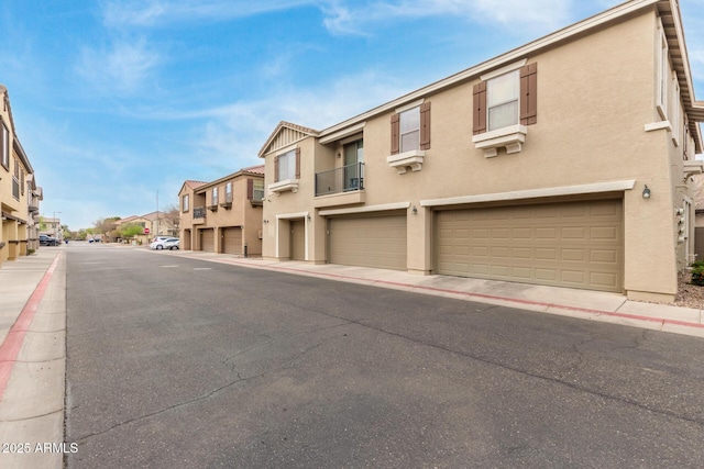 view of street featuring a residential view, curbs, and sidewalks