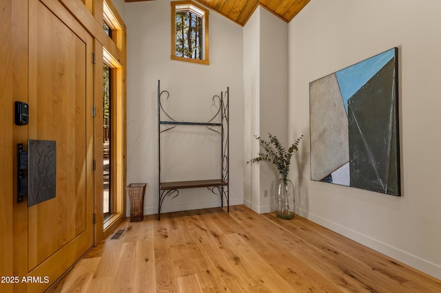 2096 William Palmer, Flagstaff, AZ 86005 - doorway with visible vents, baseboards, wood ceiling, hardwood / wood-style flooring, and vaulted ceiling