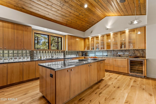 2096 William Palmer, Flagstaff, AZ 86005 - kitchen featuring a kitchen island, vaulted ceiling, wooden ceiling, black electric stovetop, and wine cooler
