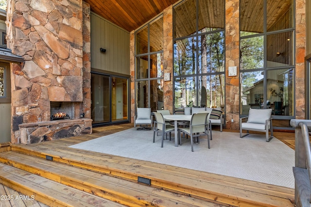 2096 William Palmer, Flagstaff, AZ 86005 - wooden deck featuring outdoor dining space and a fireplace
