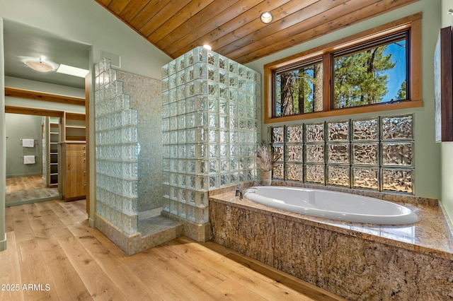 2096 William Palmer, Flagstaff, AZ 86005 - bathroom with a garden tub, walk in shower, wooden ceiling, wood-type flooring, and lofted ceiling