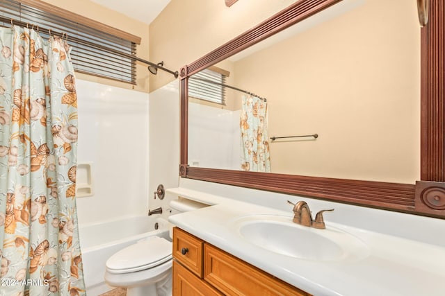 bathroom with shower / bath combination with curtain, vanity, and toilet