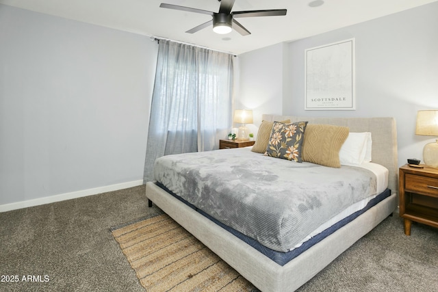 carpeted bedroom with ceiling fan and baseboards