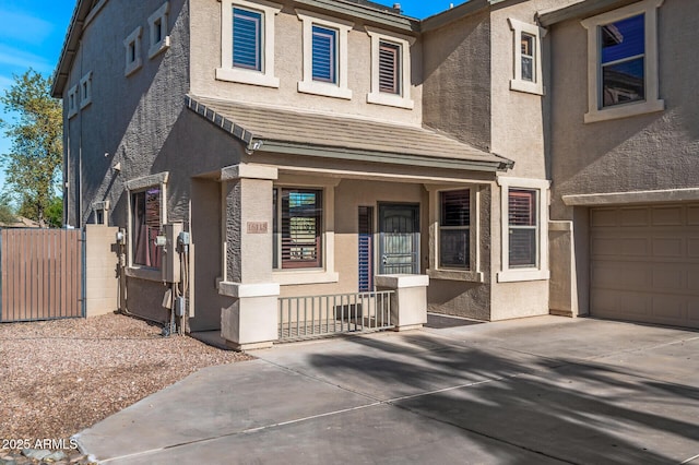 view of front of house featuring a garage and covered porch