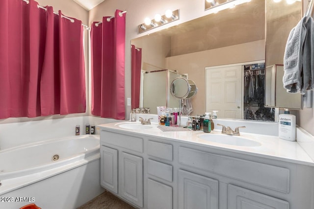 bathroom featuring vanity and a tub