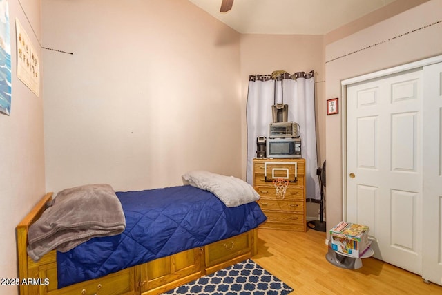 bedroom with wood-type flooring and ceiling fan