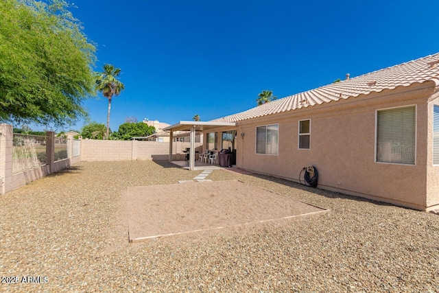 rear view of house featuring a patio