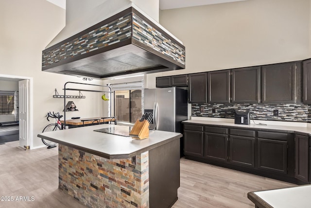 5428 W Wethersfield Dr, Glendale, AZ 85304 - kitchen with custom range hood, a towering ceiling, tasteful backsplash, and stainless steel refrigerator with ice dispenser