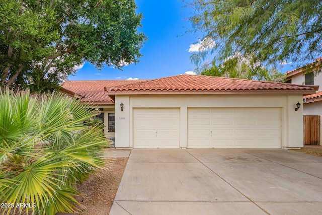 5428 W Wethersfield Dr, Glendale, AZ 85304 - view of front of house with driveway, stucco siding, an attached garage, and a tiled roof