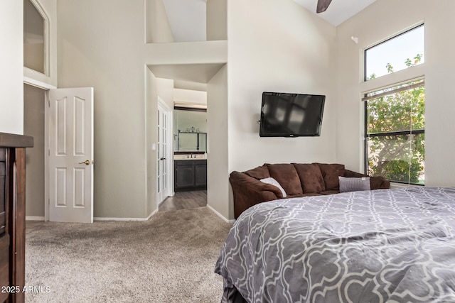 5428 W Wethersfield Dr, Glendale, AZ 85304 - carpeted bedroom with a towering ceiling, connected bathroom, and baseboards