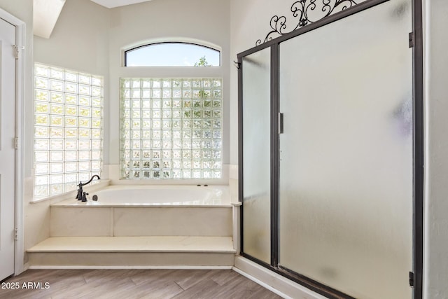 5428 W Wethersfield Dr, Glendale, AZ 85304 - full bath featuring wood finished floors, a garden tub, a shower stall, and plenty of natural light