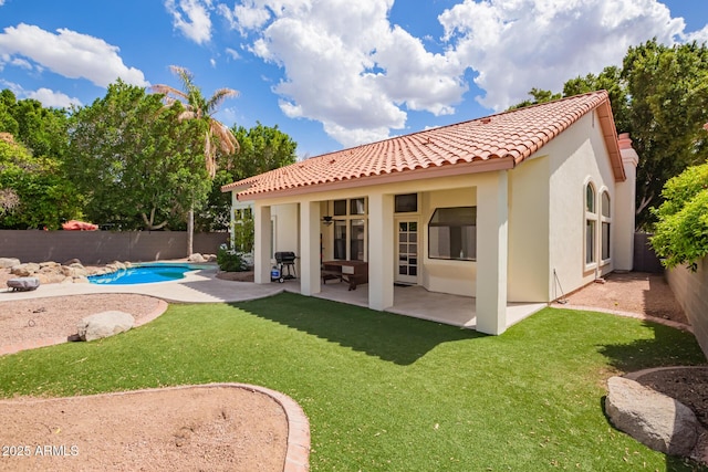 5428 W Wethersfield Dr, Glendale, AZ 85304 - back of property with a fenced backyard, a tiled roof, stucco siding, and a patio