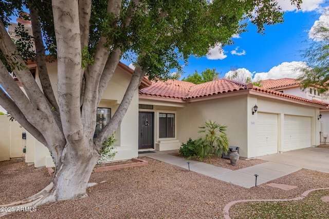 5428 W Wethersfield Dr, Glendale, AZ 85304 - view of front of property featuring a tiled roof, stucco siding, a garage, and driveway