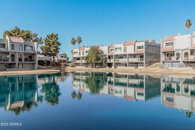 view of swimming pool with a water view