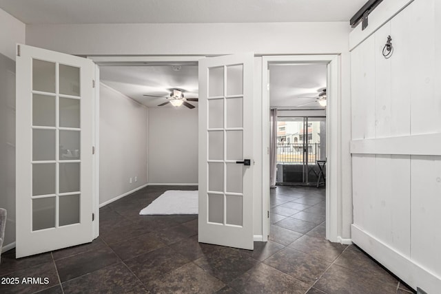 spare room with french doors and ceiling fan