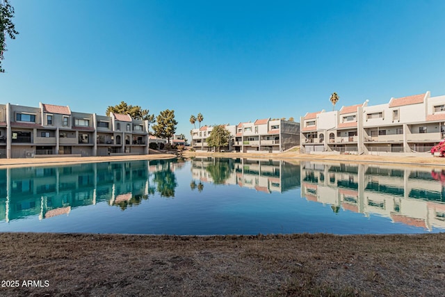 view of swimming pool featuring a water view