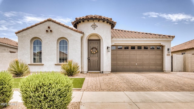 mediterranean / spanish house featuring a garage