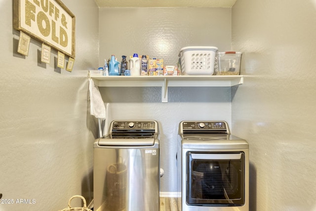 washroom with washing machine and dryer