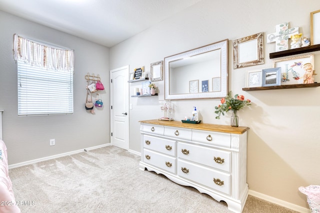 bedroom with light colored carpet