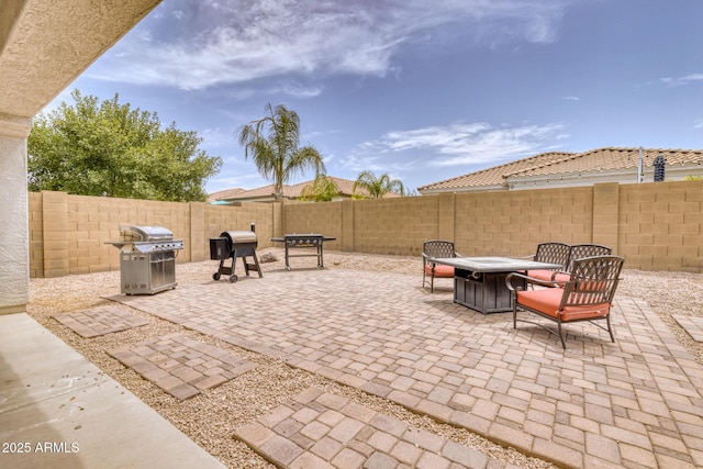 view of patio featuring a grill