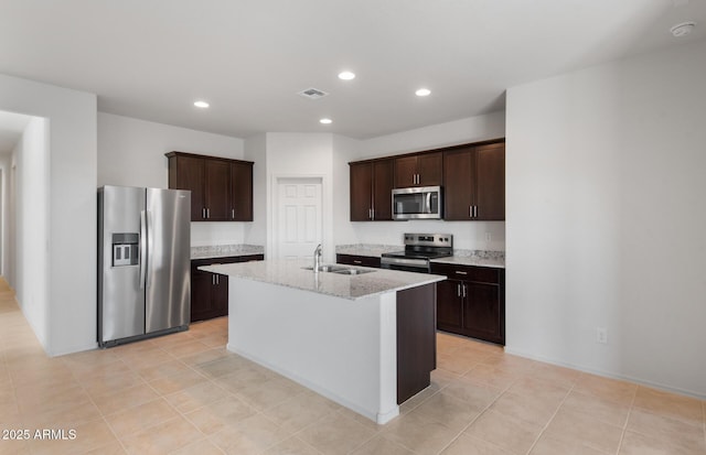 kitchen featuring stainless steel appliances, recessed lighting, visible vents, a sink, and dark brown cabinets