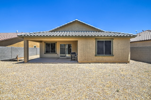 rear view of house with a patio area