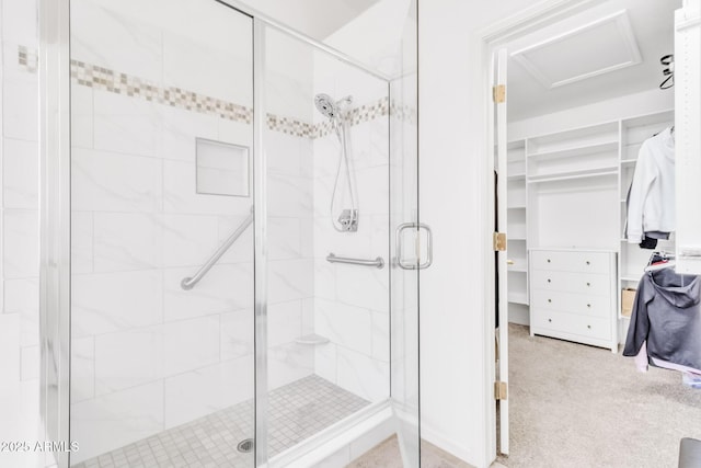 bathroom featuring a shower with door