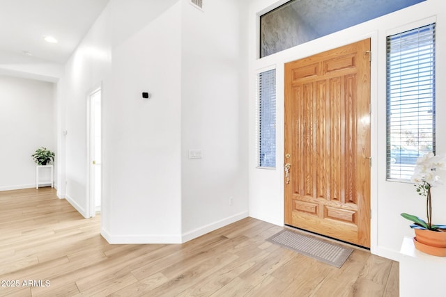 foyer entrance featuring light hardwood / wood-style flooring