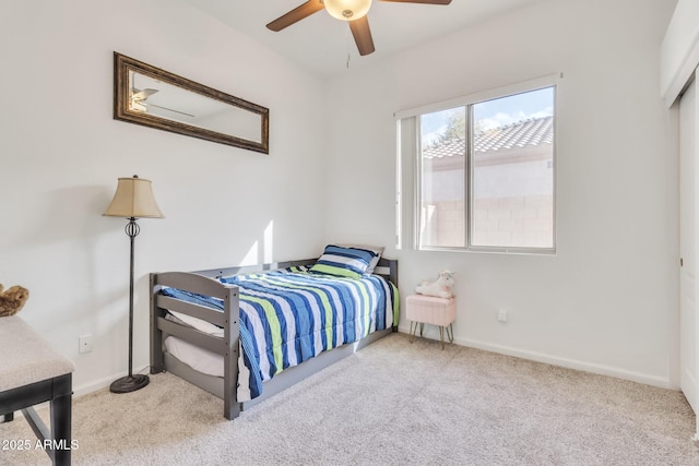 bedroom with ceiling fan and light colored carpet