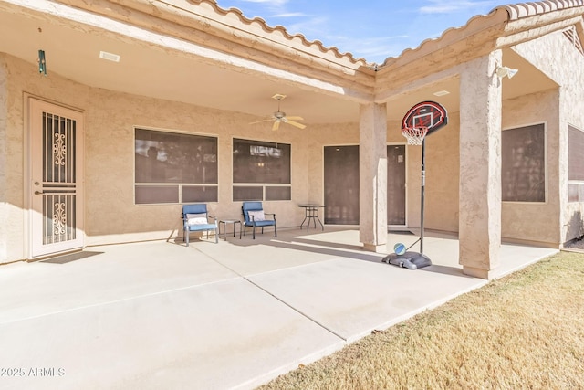 view of patio featuring ceiling fan