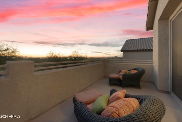 view of balcony at dusk