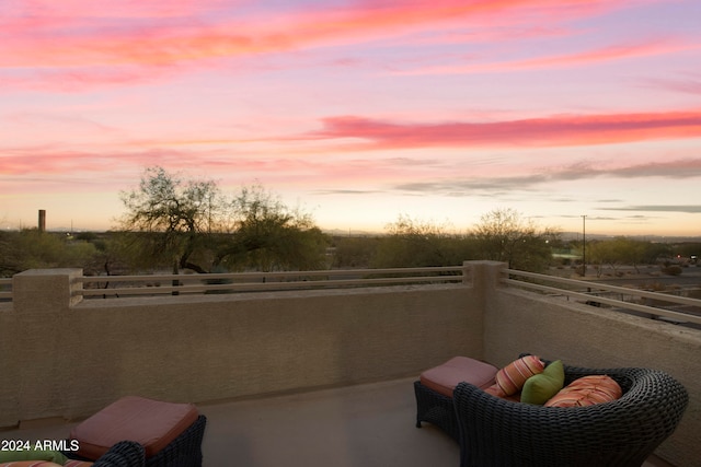 view of patio terrace at dusk