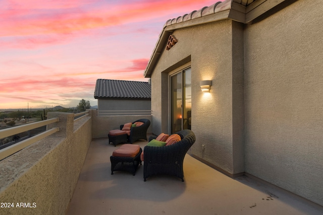 view of balcony at dusk