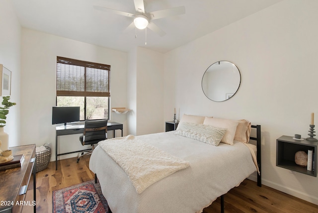 bedroom featuring dark hardwood / wood-style floors and ceiling fan