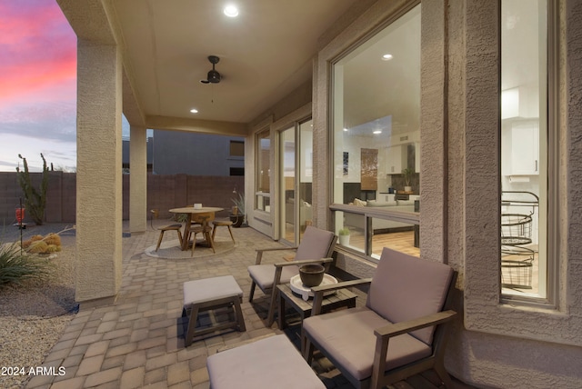 view of patio terrace at dusk