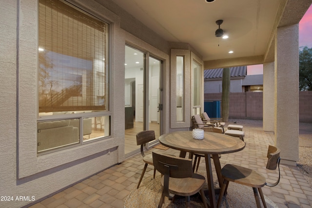 view of patio terrace at dusk