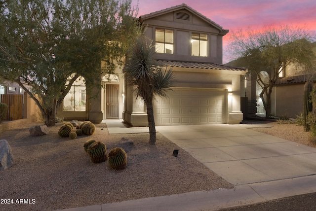 view of front of property with a garage